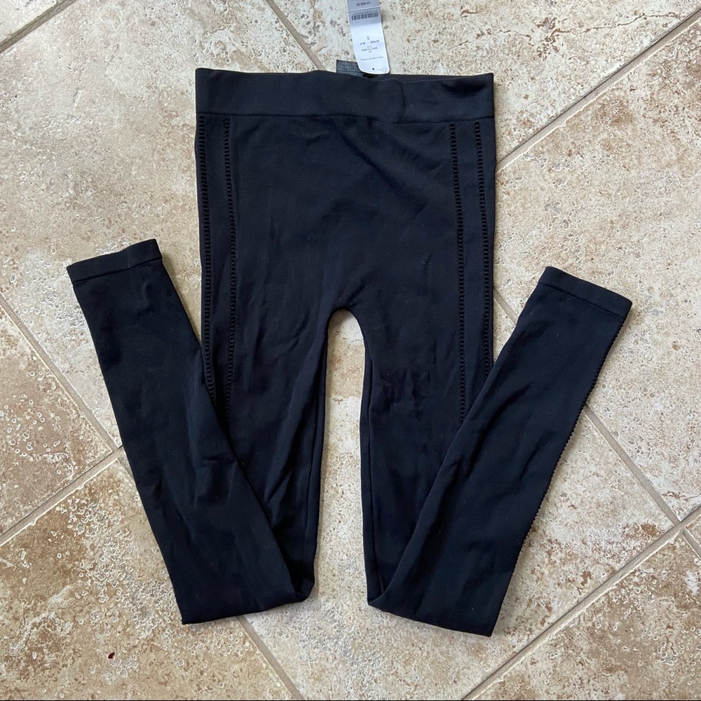 Bebe Black Leggings with cutout print
